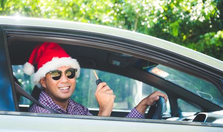 Asian man holding a car keyの写真素材