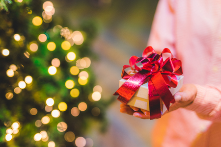 Hands holding gift box. Happiness, Christmas or new year  concept.の写真素材