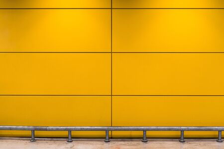 beautiful yellow cement wall background.の写真素材