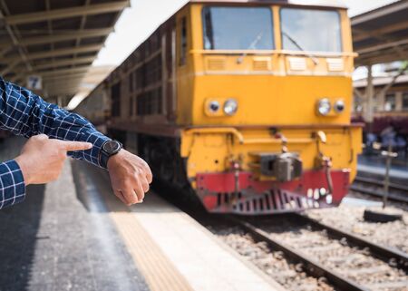 Traveler looking a watch in bangkok train stationの写真素材