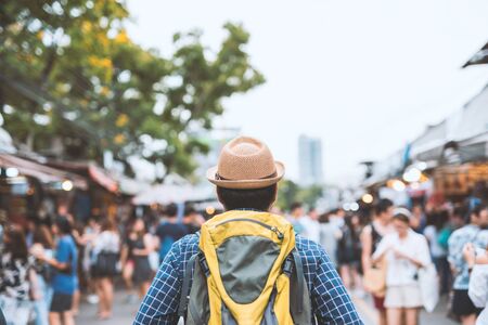 Traveling man walking at Chatuchak Market in Bangkok Thailand.の写真素材