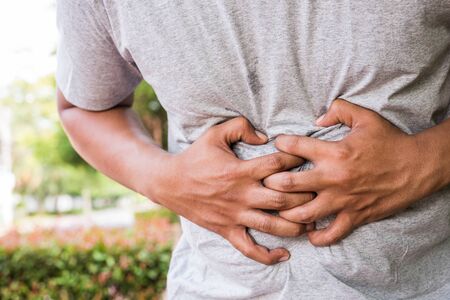Close up Young Man has stomachache