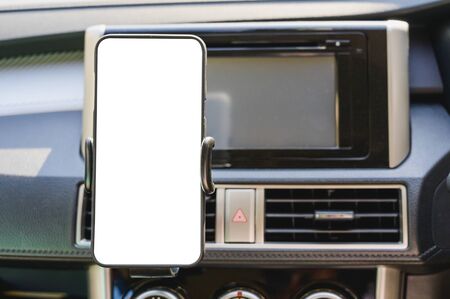 Blank screen of smartphone on holder for Navigate or GPS.の写真素材