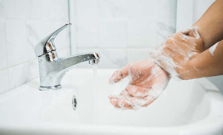 Close up Male hands washing hands with soap. for corona virus prevention.