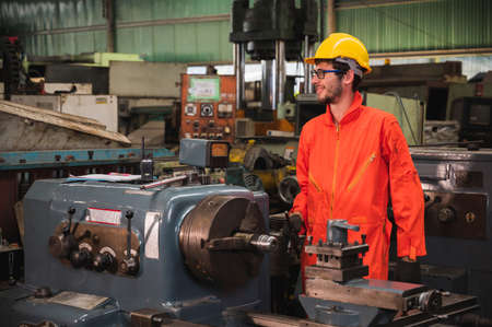 Industrial workers are working on projects in large industrial plants with many devices.の写真素材