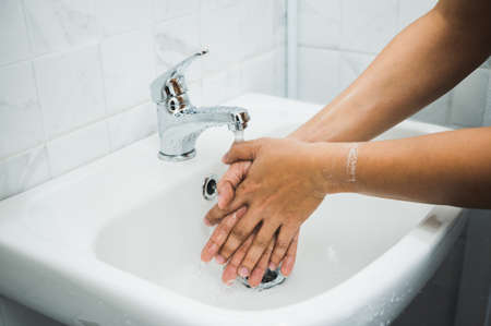 Close up Male hands washing hands with soap. for corona virus prevention.
