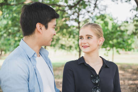 Young lovers say love in the park Romanticly. On a relaxing holiday