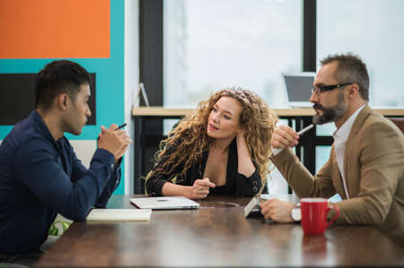 Business people team colleagues in modern office. Man and womanの写真素材