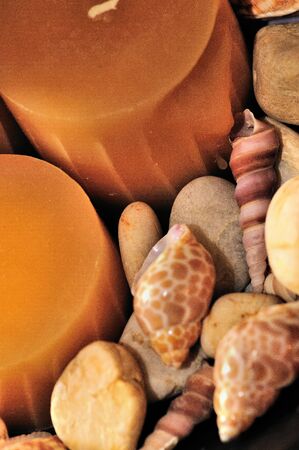 Home decoration with candles rocks and shellsの写真素材