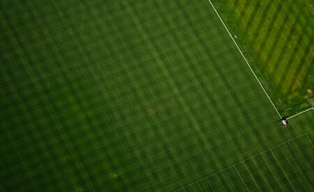 Aerial perspective of mowing pattern in football training field.のeditorial素材