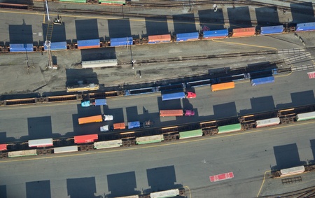 Overhead shot of different colored trucks and shipping containersのeditorial素材