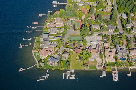Aerial perspective of rich homes by lakeの写真素材