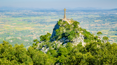 Felanitx, Mallorca, Spain â May 11 2011: The Cross of Santuario De San Salvador located in the Sanctuary de Sant Salvador: The cross stands 14m tall and is 509m above sea level on the highest point of the Serra de Llevant.のeditorial素材
