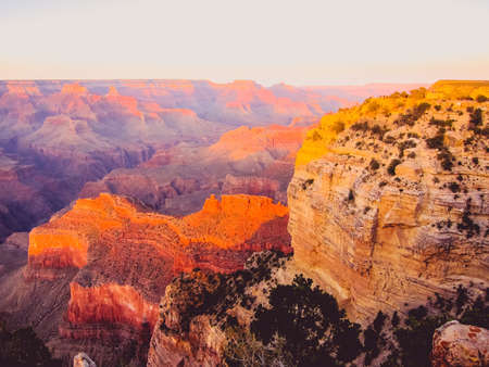 bright pink sunset on the rocksの写真素材