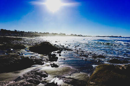 Bright sun reflecting on the California coastの写真素材