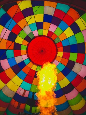 fire inflating a colorful hot air balloonの写真素材