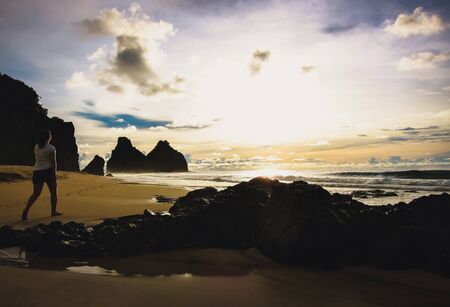girl walking on the beachの写真素材