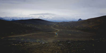 Hiking across black volcanic sand in Iceland