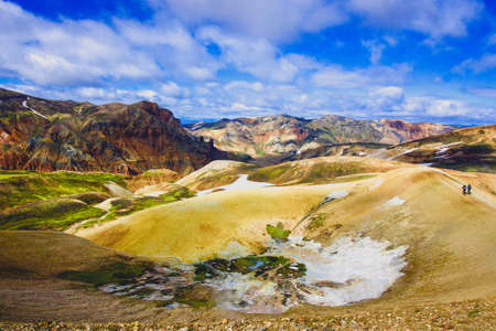Hiking through colorful rocks in Icelandの写真素材