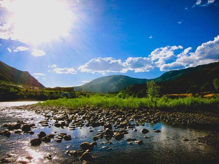 hopeful sun shining on the river bedの写真素材
