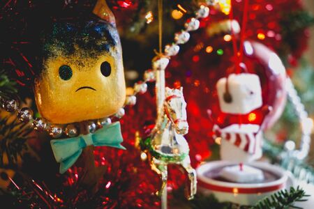 sad toasted marshmallow ornament on a Christmas treeの写真素材