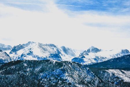 windy snowy mountaintops in coloradoの写真素材