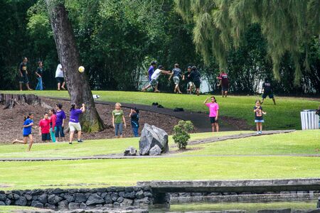 HILO, HAWAII, MAY 2011: Children and teenagers playing at Liliuokalani Gardens on the Big Island,...