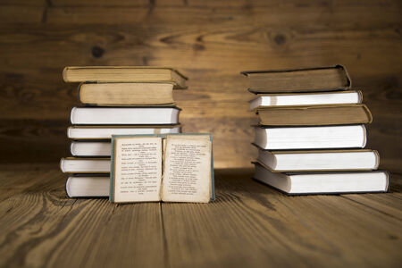 Vintage law and medicine books on wooden table in libraryの写真素材