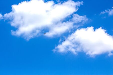 Blue sky background with clouds wallpaperの写真素材