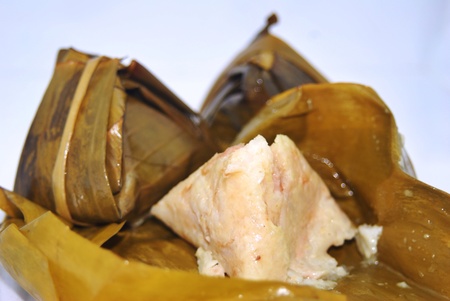 Steamed rice wrapped in banana leavesの素材