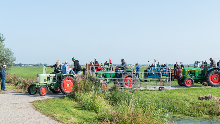 Katwoude, Netherlands - 2018-09-02: The first tractors start movのeditorial素材