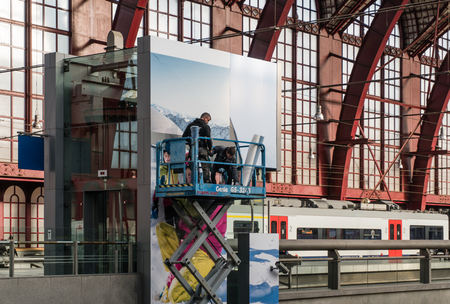 Antwerp, Belgium - 2018-10-01: Teamwork on the job high above the ground