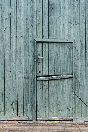 Green painted wooden Dutch Barn Door - verticalのeditorial素材
