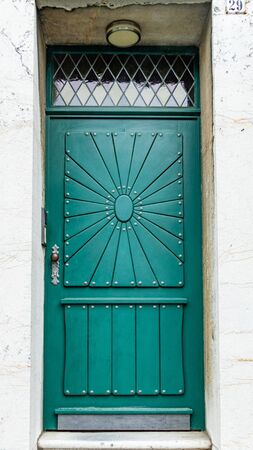 Green ornamented front door - close-upのeditorial素材