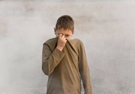 	The child in a smoke from firesの写真素材