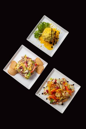 three plates of salad on the table, top viewの写真素材