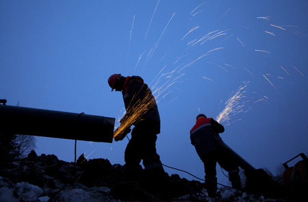 Workers working on the construction of the pipelineの写真素材