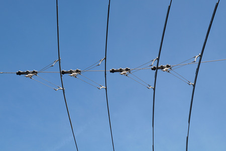 tram wires with blue sky backgroundの写真素材