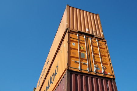 OAKLAND, CALIFORNIA - FEBRUARY 26, 2015: The average container ship can hold 3,500 containers. Shipping containers are organized and placed algorithmically for efficient transport.のeditorial素材