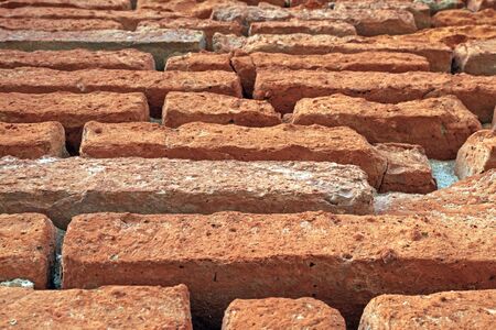Background of old vintage red brick wall .の写真素材