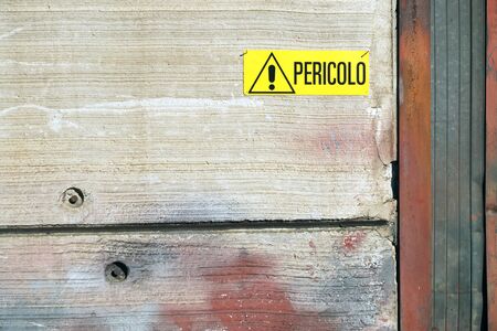 danger warning sign on the industrial wallの写真素材