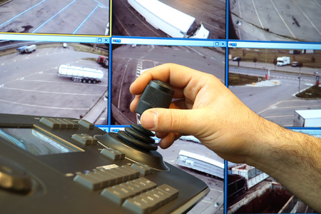 security control room with keyboard and joystick to remove and control camerasの写真素材