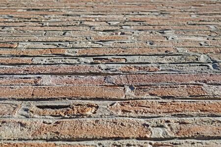 Red brick wall as a nicely textured backgroundの写真素材