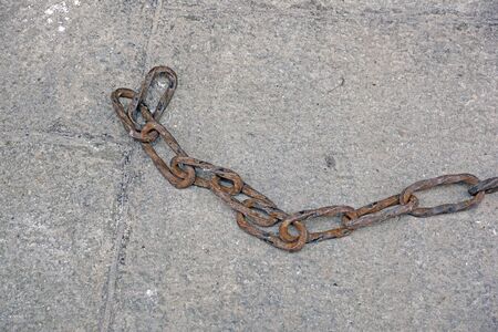 old rust chain on the floor.