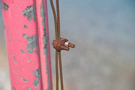 The rusty iron pulley with blue sky background .