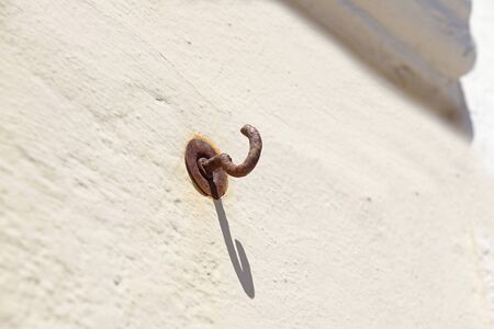 rusted hook on the wall