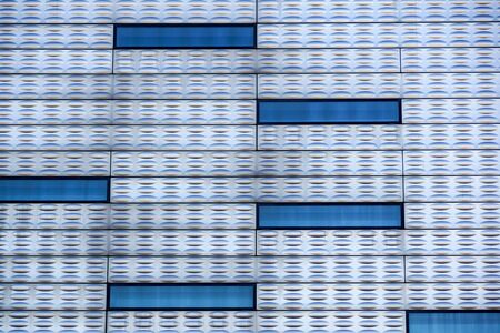 Abstract facade lines and glass reflection on modern building,abstract backgroundの写真素材