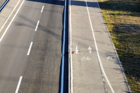 Bicycle lane across the road in Italy .