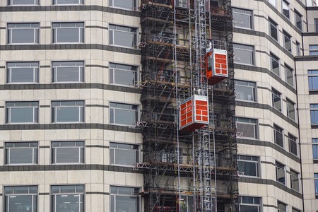 external hoists used in building construction to bring work materialsの写真素材