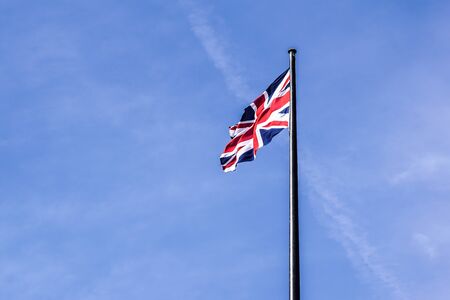 The British flag waving in the wind .